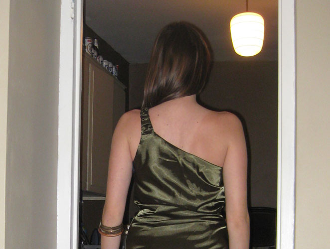 black dress with gold studs. (front of dress with nude +