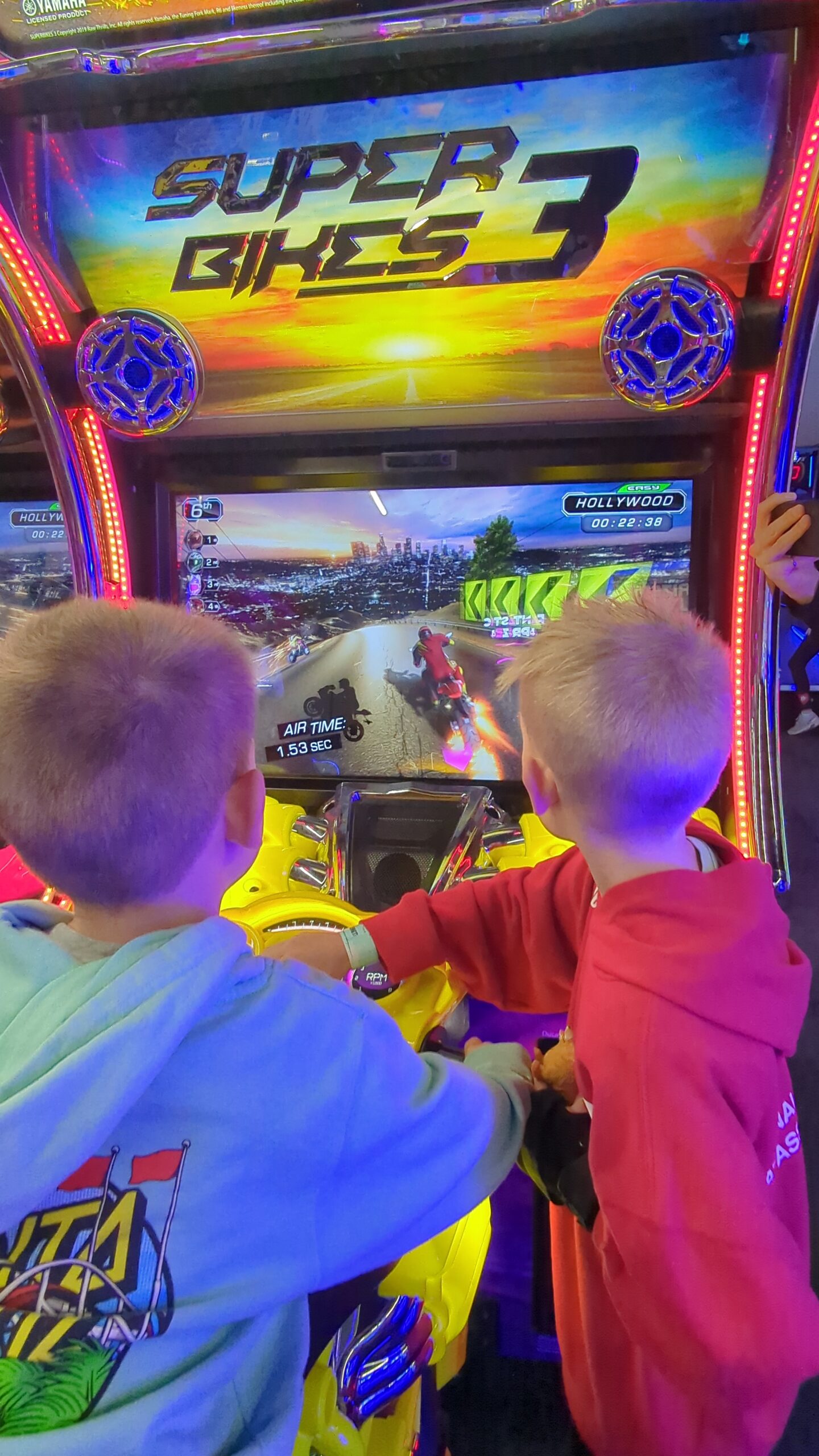 My two boys play video games at the arcade at the Great Wolf Lodge.
